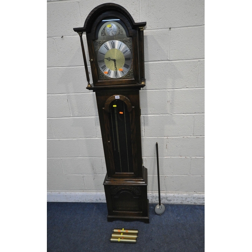 1283 - TEMPUS FUGIT, A 20TH CENTURY OAK LONGCASE CLOCK, the arched good with a glass door, that's enclosing... 