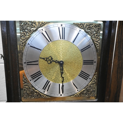 1283 - TEMPUS FUGIT, A 20TH CENTURY OAK LONGCASE CLOCK, the arched good with a glass door, that's enclosing... 