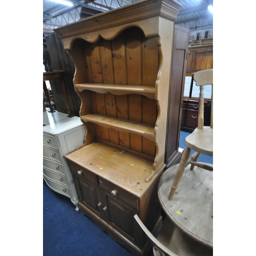 1287 - A LATE 20TH CENTURY PINE DRESSER, the two tier plate rack atop a base, fitted with two drawers, abov... 