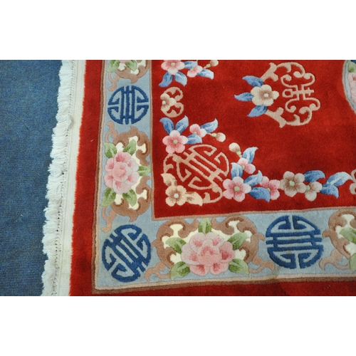 1291 - A RED GROUND RECTANGULAR CHINESE WOOLEN RUG, 170cm x 95cm (condition report: ideal for a clean)