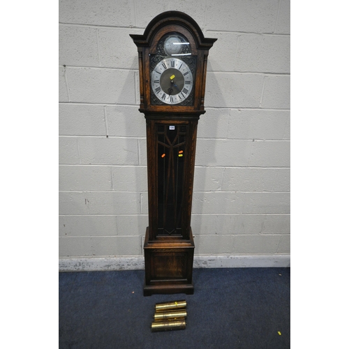 1292 - A 20TH CENTURY OAK LONGCASE CLOCK, the arched glass door enclosing a 9.5 inch brass and silvered dia... 