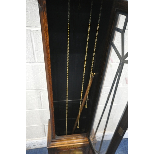 1292 - A 20TH CENTURY OAK LONGCASE CLOCK, the arched glass door enclosing a 9.5 inch brass and silvered dia... 