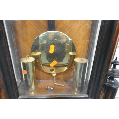 1293 - A VICTORIAN STYLE WALNUT VIENNA WALL CLOCK, the glass door enclosing a 7 inch brass and enamel dial,... 