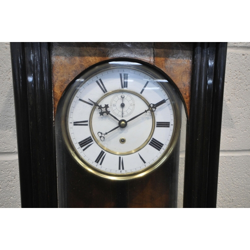 1293 - A VICTORIAN STYLE WALNUT VIENNA WALL CLOCK, the glass door enclosing a 7 inch brass and enamel dial,... 