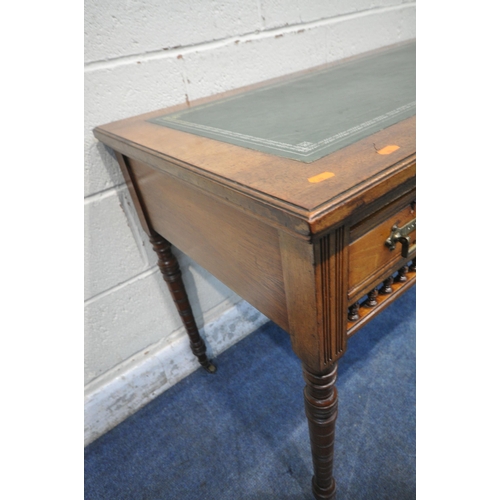 1299 - AN EDWARDIAN WALNUT DESK, with a green leather writing surface, three frieze drawers, turned and tap... 