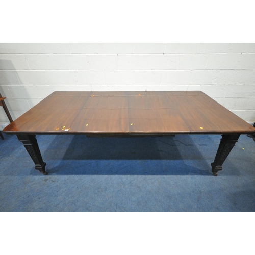 1300 - AN EDWARDIAN MAHOGANY WIND OUT DINING TABLE, with two additional leaves raised on square tapered leg... 