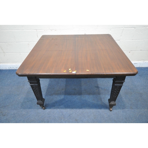 1300 - AN EDWARDIAN MAHOGANY WIND OUT DINING TABLE, with two additional leaves raised on square tapered leg... 