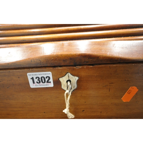 1302 - AN EARLY 20TH CENTURY MAHOGANY STATIONARY CABINET, with a tambour door, that's enclosing a fitted in... 