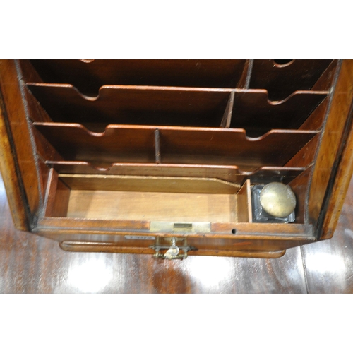 1302 - AN EARLY 20TH CENTURY MAHOGANY STATIONARY CABINET, with a tambour door, that's enclosing a fitted in... 