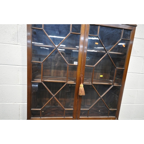 1303 - A GEORGIAN MAHOGANY BUREAU BOOKCASE, the double glazed doors enclosing two shelves, atop a base with... 