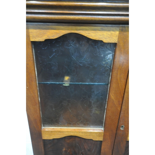 1304 - A 20TH CENTURY MAHOGANY CABINET ON STAND, with double glazed doors, raised on square tapered legs, w... 