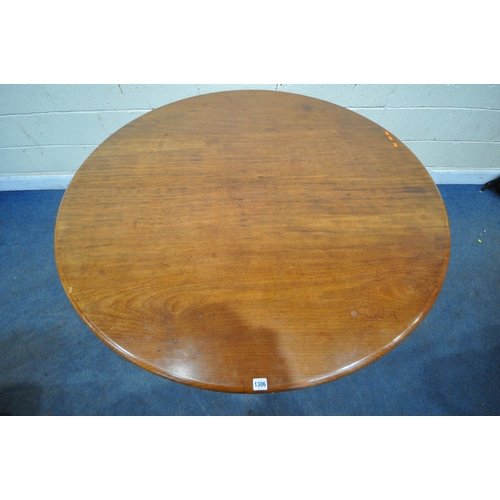 1306 - A VICTORIAN CIRCULAR BREAKFAST TABLE, the tilting top raised on a bulbous turned supports, shaped le... 