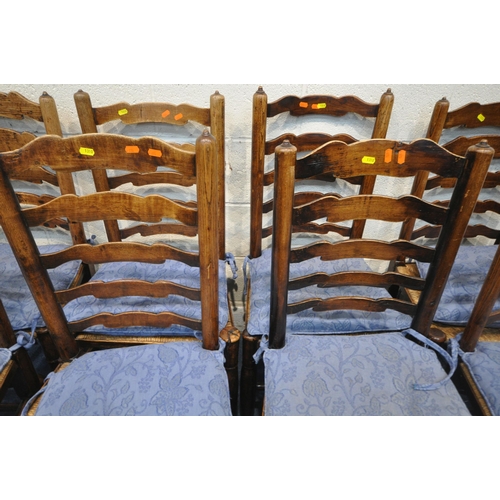 1310 - A HARLEQUIN SET OF EIGHT EARLY 20TH CENTURY OAK LADDERBACK CHAIRS, with rush seats, raised on turned... 