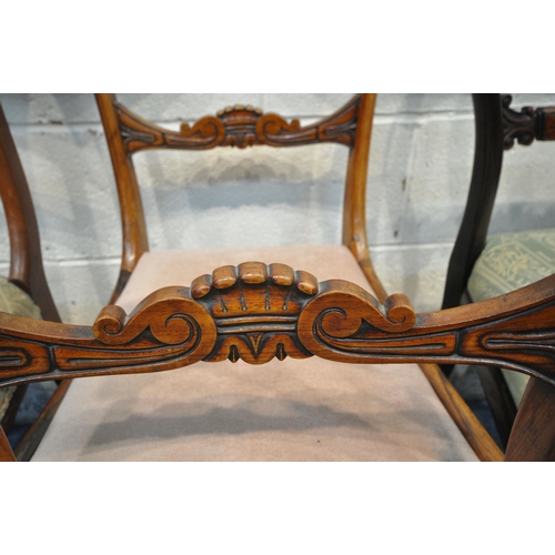 1313 - A PAIR OF REGENCY ROSEWOOD CHAIRS, with shaped backrest, raised on tapered and fluted front legs, an... 