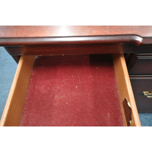 1326 - J E COYLE LTD, A REPRODUCTION MAHOGANY SIDEBOARD, with a raised back, three drawers above three cupb... 