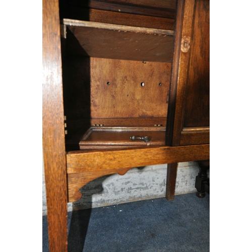 1327 - TWO 20TH CENTURY OAK BUREAUS, the fall front doors enclosing a fitted interior, the larger bureau wi... 