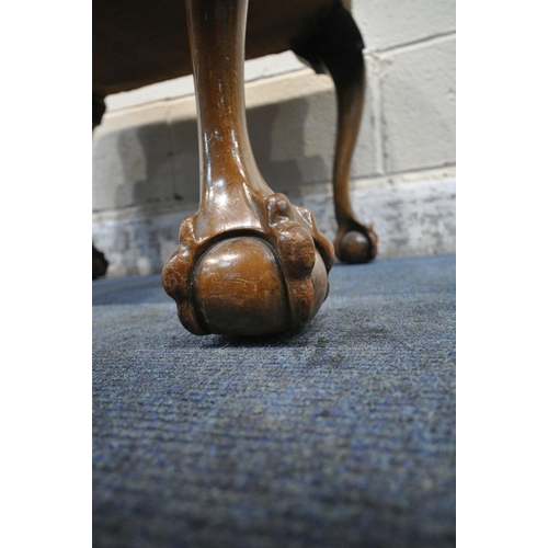 1334 - AN EARLY 20TH CENTURY RECTANGULAR STOOL, raised on cabriole legs, with ball and claw feet, width 67c... 