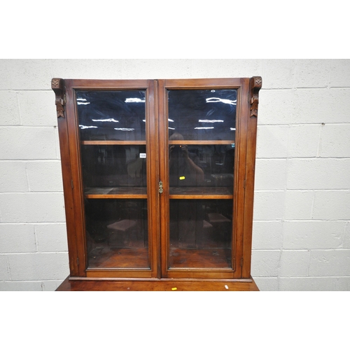 1335 - A 19TH CENTURY MAHOGANY BOOKCASE, with double glazed doors, atop a base with a single drawer and dou... 