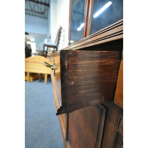 1335 - A 19TH CENTURY MAHOGANY BOOKCASE, with double glazed doors, atop a base with a single drawer and dou... 