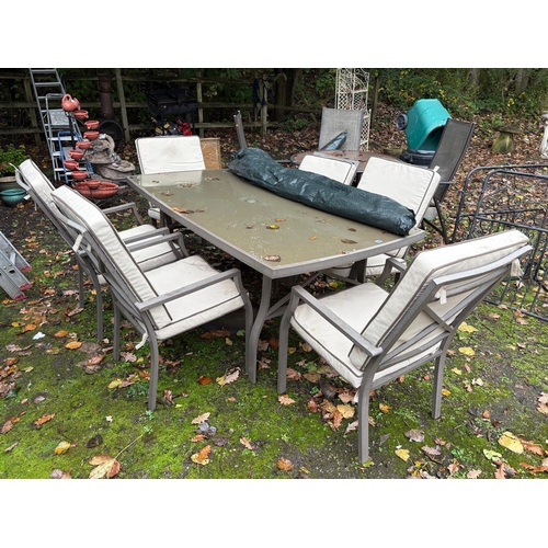 1006 - A MODERN METAL AND GLASS BELLAGIO GARDEN TABLE, width 100cm length 186cm, and six matching chairs, w... 