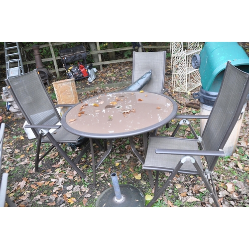 1007 - A MODERN METAL AND GLASS GARDEN TABLE, table diameter 110cm, and three folding chairs, along with a ... 