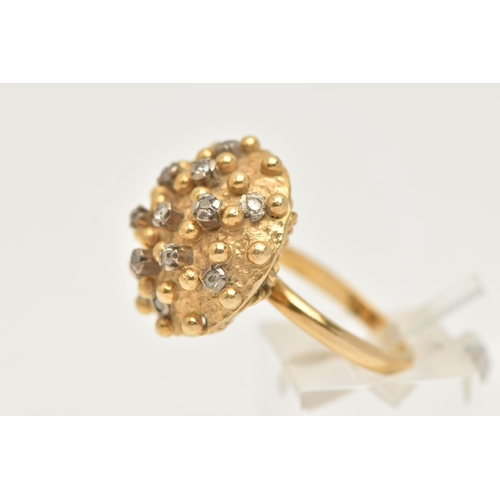 1 - A YELLOW METAL AND DIAMOND BOMBE RING, designed as a raised circular hollow dome with beading detail... 