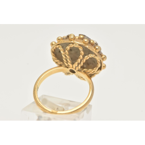 1 - A YELLOW METAL AND DIAMOND BOMBE RING, designed as a raised circular hollow dome with beading detail... 