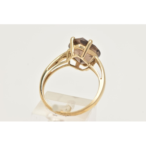 11 - A 9CT GOLD SMOKY QUARTZ RING, a single fancy cut stone, prong set in yellow gold, hallmarked 9ct Bir... 