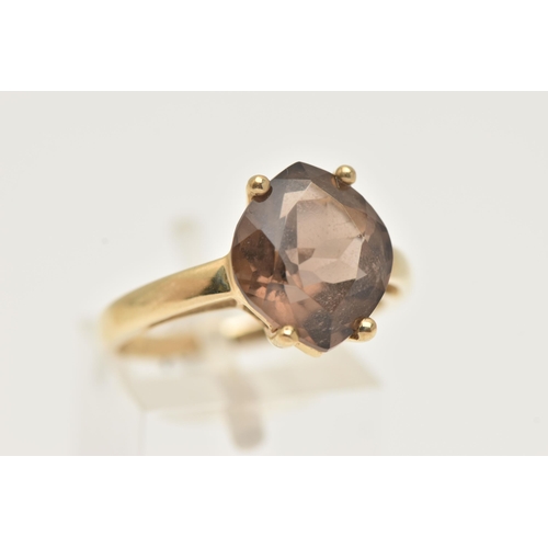 11 - A 9CT GOLD SMOKY QUARTZ RING, a single fancy cut stone, prong set in yellow gold, hallmarked 9ct Bir... 