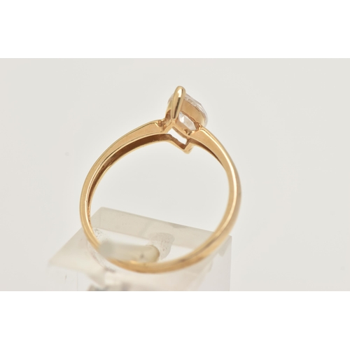 12 - AN 18CT GOLD SINGLE STONE RING, a marquise cut colourless cubic zirconia, prong set in yellow gold, ... 