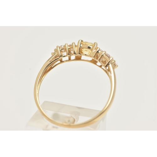 15 - A 14CT GOLD CLUSTER RING, set with a circular cut yellow cubic zirconia and ten circular cut colourl... 