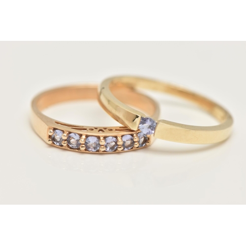 23 - TWO 9CT GOLD GEM SET RINGS, a single stone ring and a six stone band ring, set with circular cut tan... 