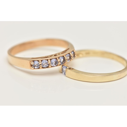 23 - TWO 9CT GOLD GEM SET RINGS, a single stone ring and a six stone band ring, set with circular cut tan... 