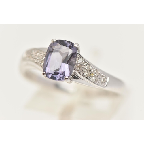 24 - A 9CT GOLD GEM SET RING, a fancy cut amethyst flanked with cubic zirconia set shoulders, hallmarked ... 