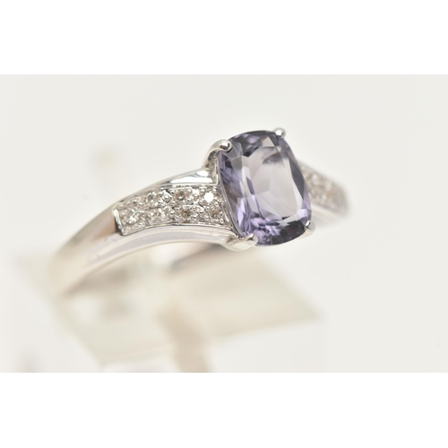 24 - A 9CT GOLD GEM SET RING, a fancy cut amethyst flanked with cubic zirconia set shoulders, hallmarked ... 