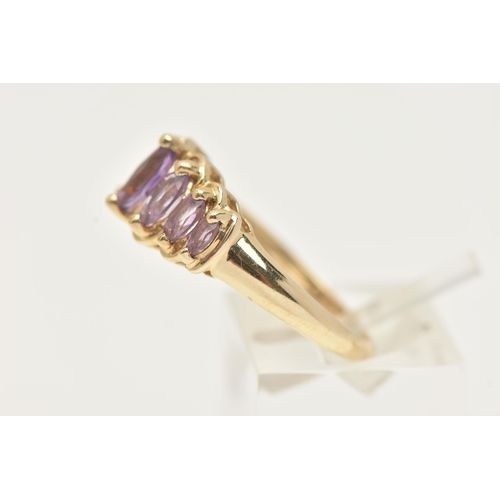 26 - A 9CT GOLD GEM SET RING, seven marquise cut amethysts, prong set in yellow gold, hallmarked 9ct Birm... 