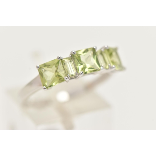 28 - A 9CT GOLD GEM SET RING, three square cut and two rectangular cut green stones, prong set in white g... 