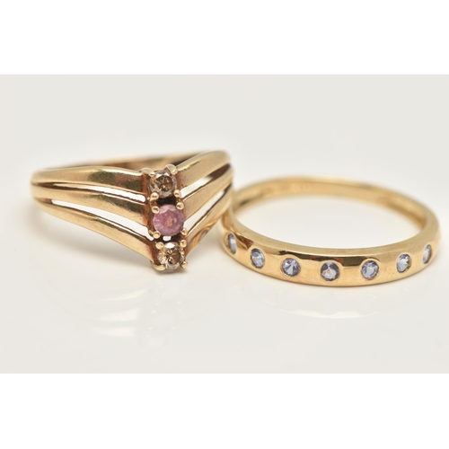 37 - TWO 9CT GOLD GEM SET RINGS, a yellow gold three stone wish bone ring, and a yellow gold seven stone ... 