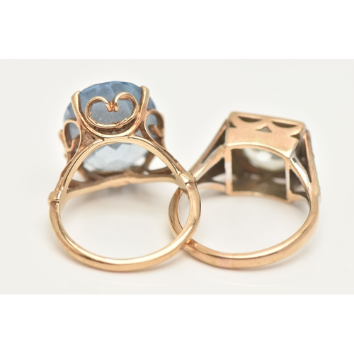 5 - TWO GEM SET RINGS, the first a yellow gold mount, set with an oval cut blue topaz, six prong setting... 