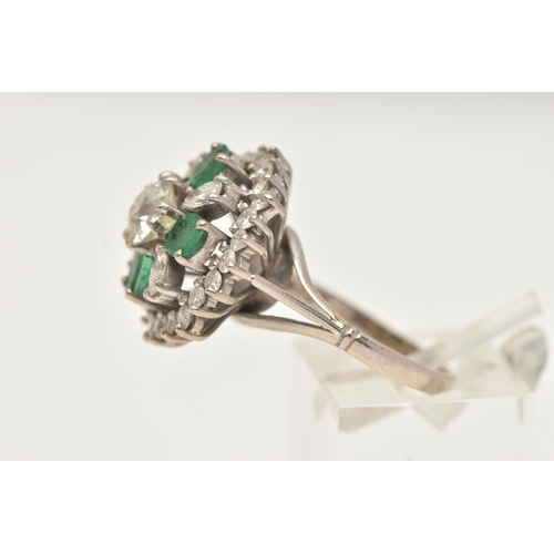 6 - A DIAMOND AND EMERALD CLUSTER RING, a large floral design, principally set with an old cut diamond, ... 