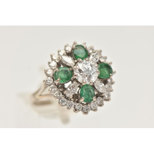 6 - A DIAMOND AND EMERALD CLUSTER RING, a large floral design, principally set with an old cut diamond, ... 