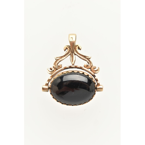 63 - A 9CT GOLD SPINNING FOB, yellow gold fob, set with onyx and tigers eye, scrolling detail with a tape... 