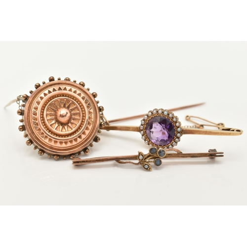 69 - THREE BROOCHES, the first a principally set circular cut amethyst, set with a surround of seed pearl... 