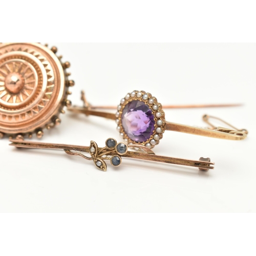 69 - THREE BROOCHES, the first a principally set circular cut amethyst, set with a surround of seed pearl... 