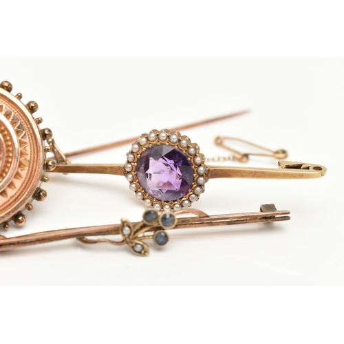 69 - THREE BROOCHES, the first a principally set circular cut amethyst, set with a surround of seed pearl... 