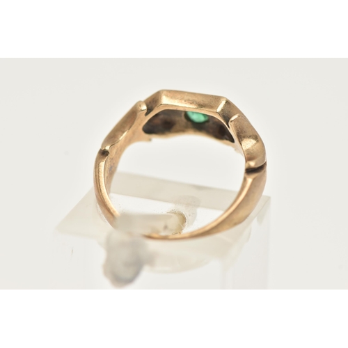 7 - A 9CT GOLD EMERALD AND DIAMOND RING, a principally set circular cut emerald, flanked with six single... 