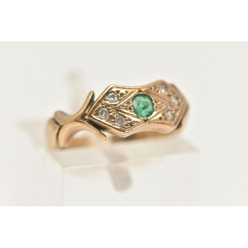 7 - A 9CT GOLD EMERALD AND DIAMOND RING, a principally set circular cut emerald, flanked with six single... 