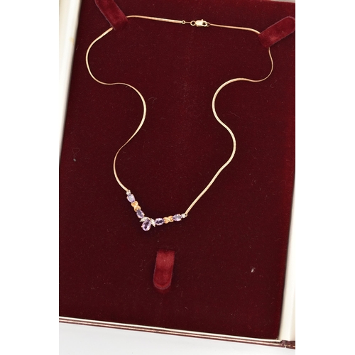 82 - A 9CT GOLD GEM SET NECKLACE, a festoon style necklace, set with five pear cut amethysts and diamond ... 