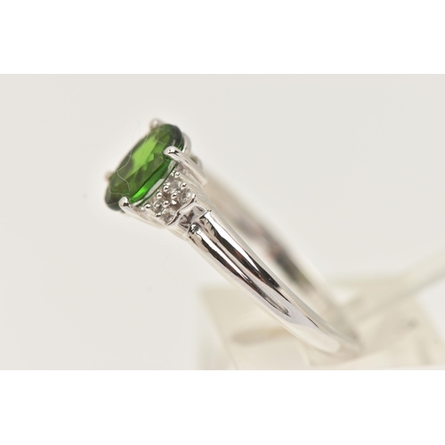 88 - A 9CT GOLD GEM SET RING, an oval cut green stone assessed as tourmaline, flanked with four circular ... 