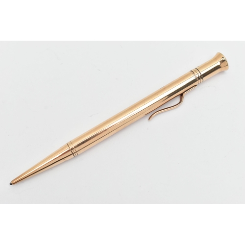 101 - A 9CT GOLD PROPELLING PENCIL, a yellow gold retractable pencil with a pocket clip, engraved with nam... 